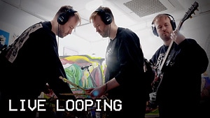 3 images of the same man playing guitar and a drum midi controller at an art gallery